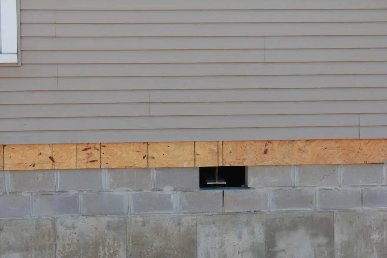 the side of a house with a hole in it