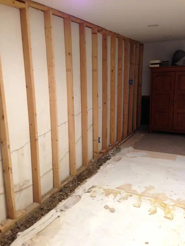 a room with a wooden wall and a wooden cabinet