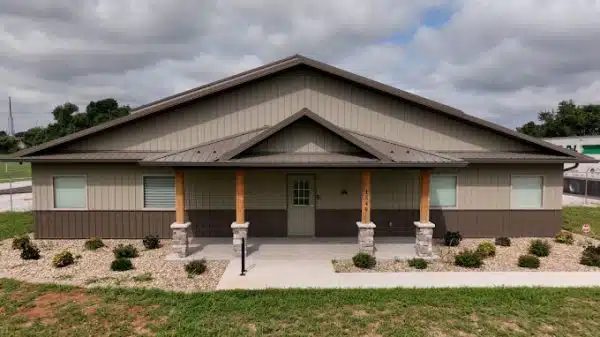 a house with a porch and a sign that says no parking