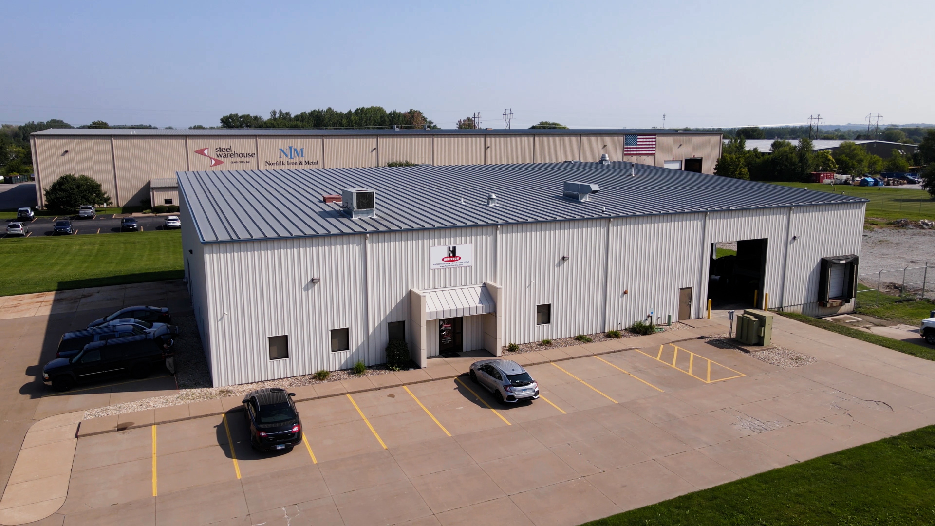 an aerial view of a building that says nm manufacturing