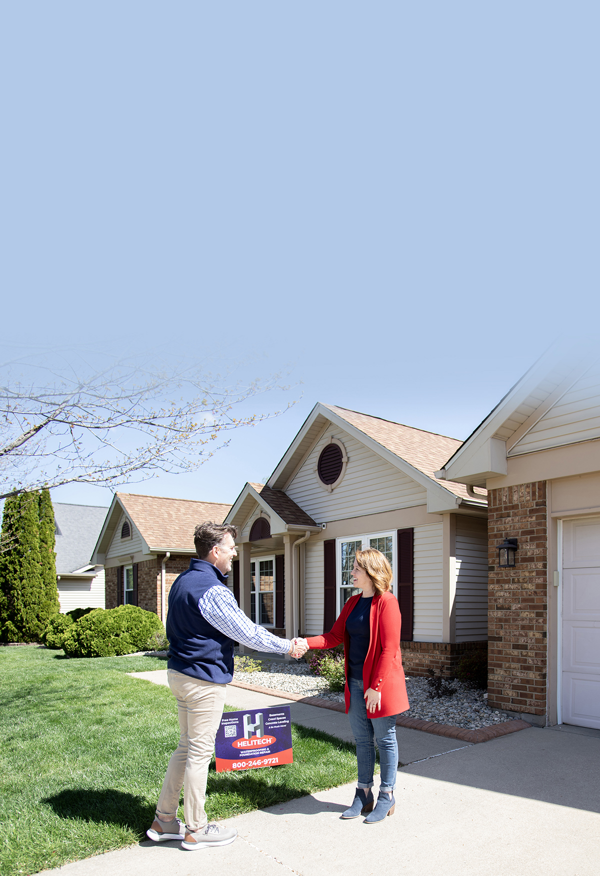 woman and man shaking hands by home