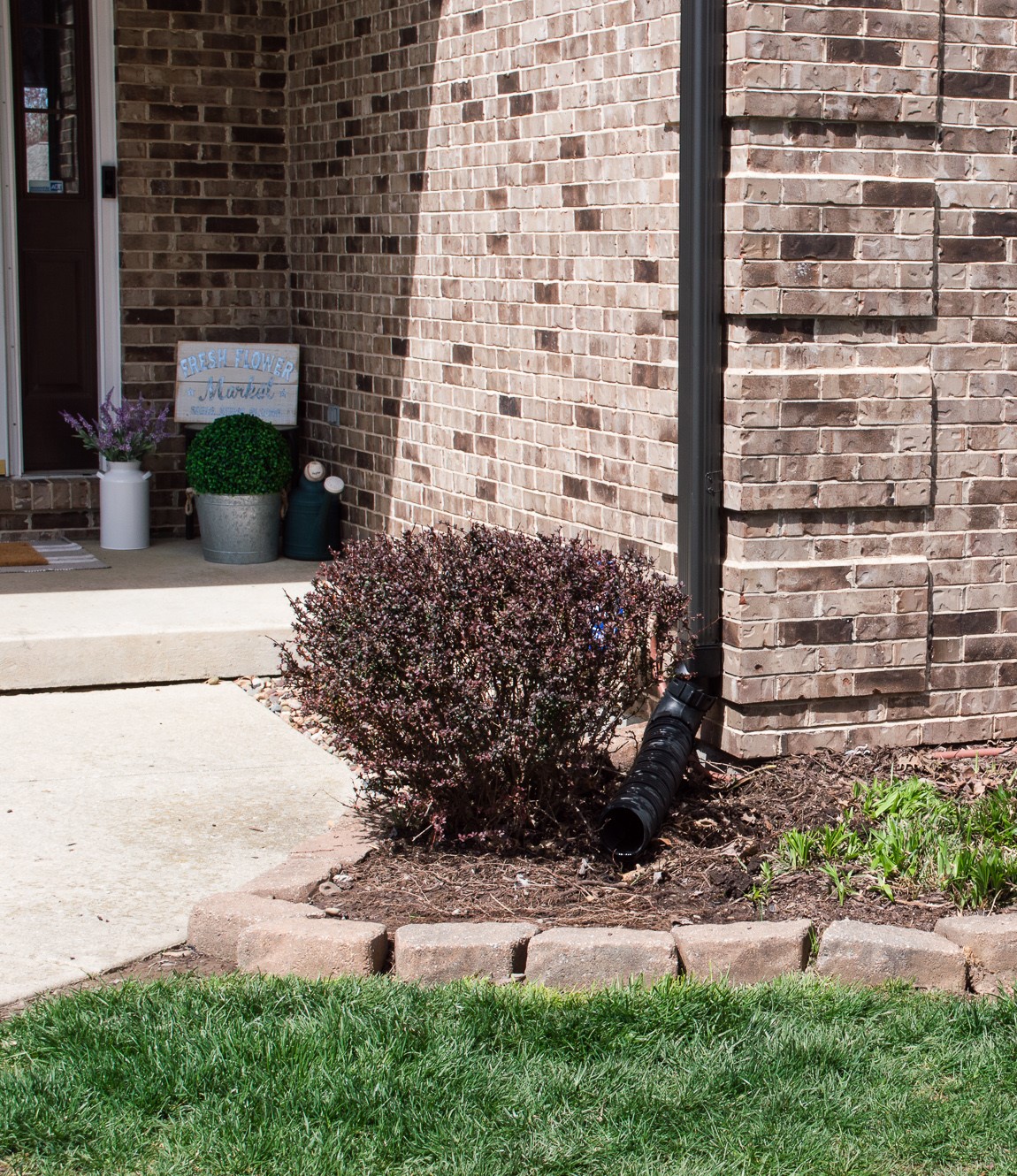 waterproofing downspout solutions into garden bed