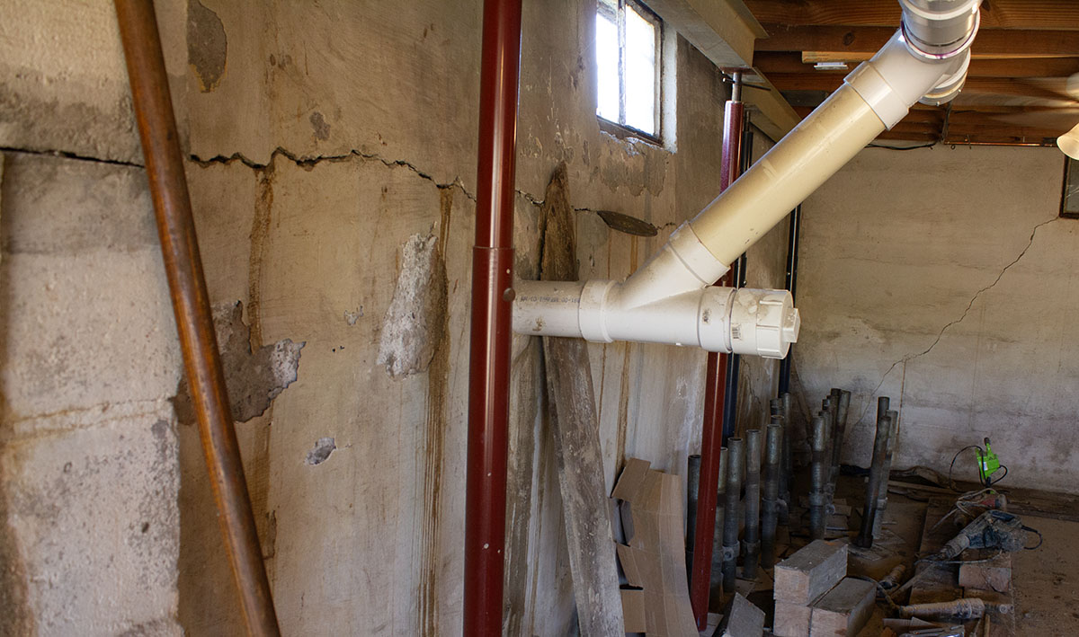 Helitech damaged basement wall requiring reconstruction for structural crack repair