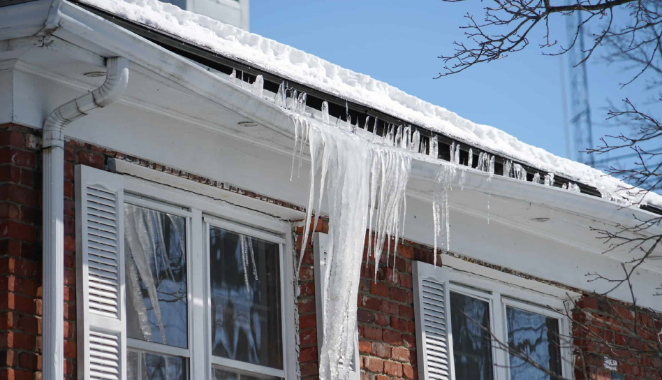 Water overflowing from faulty gutters.
