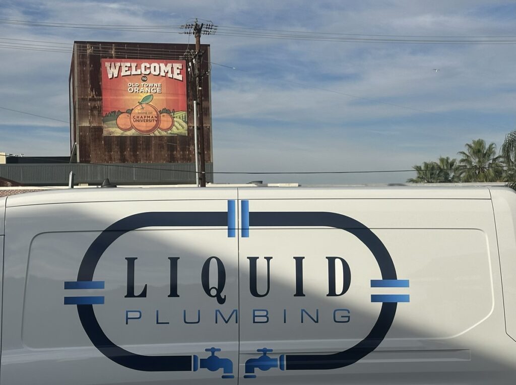 Liquid Plumbing Truck in Front of Old Towne Orange Sign