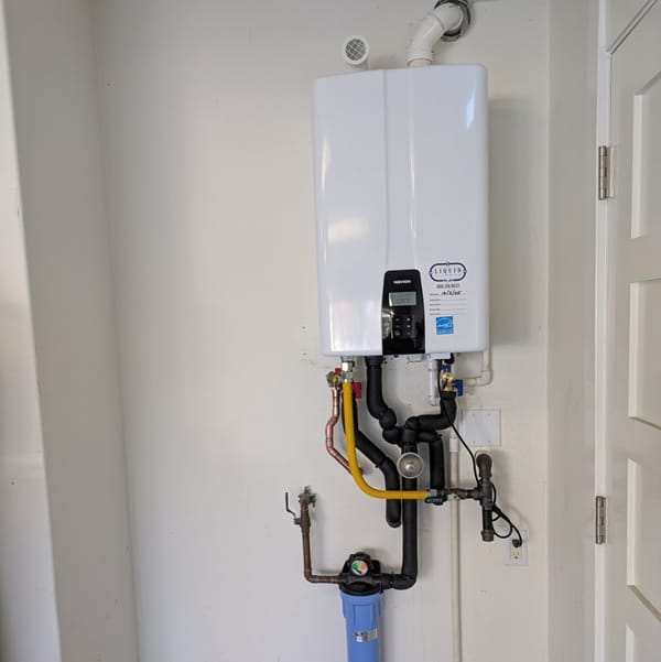 Tank to tankless water heater replacement with an Navien unit.